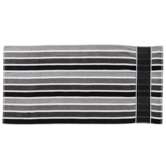 A striped towel featuring shades of grey and black, with a section displaying a logo.