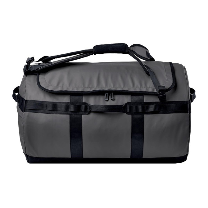 A grey duffle bag with black straps and handles, featuring a logo on the side.
