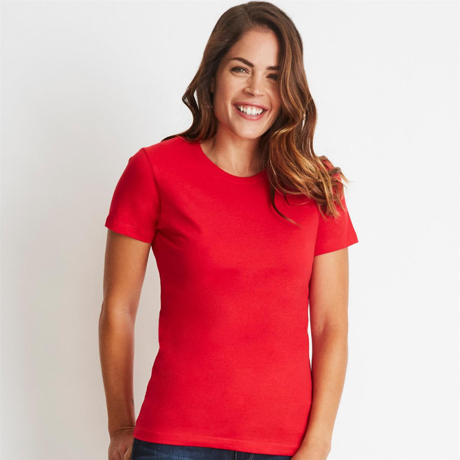 A red women's boyfriend tee featuring a classic crew neckline and short sleeves, modelled by a smiling woman.