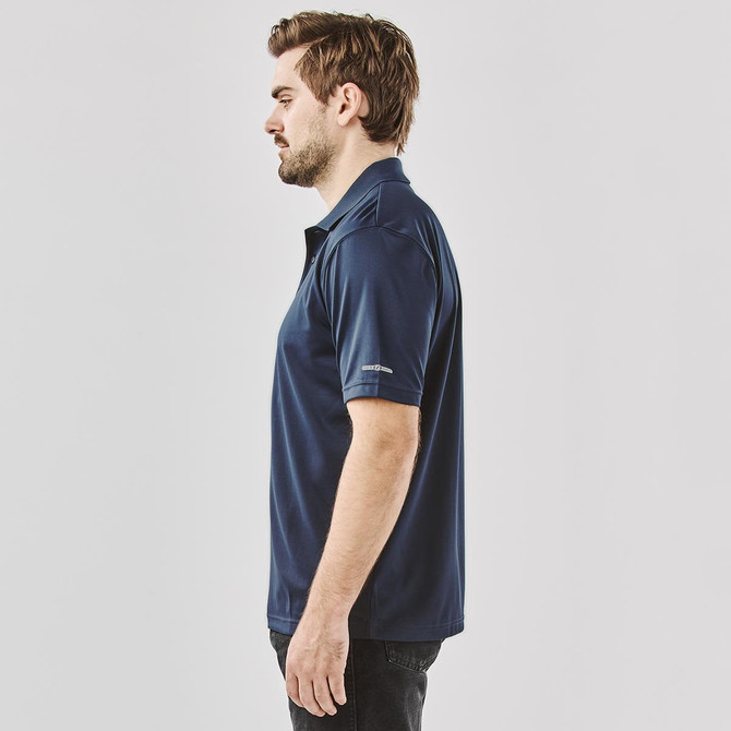 Men's polo shirt in navy blue, featuring a logo, displayed from the side. Suitable for casual or active wear.