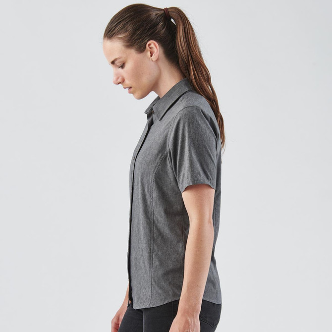A women's button-up shirt in grey with a collared neckline and short sleeves, featuring a logo.