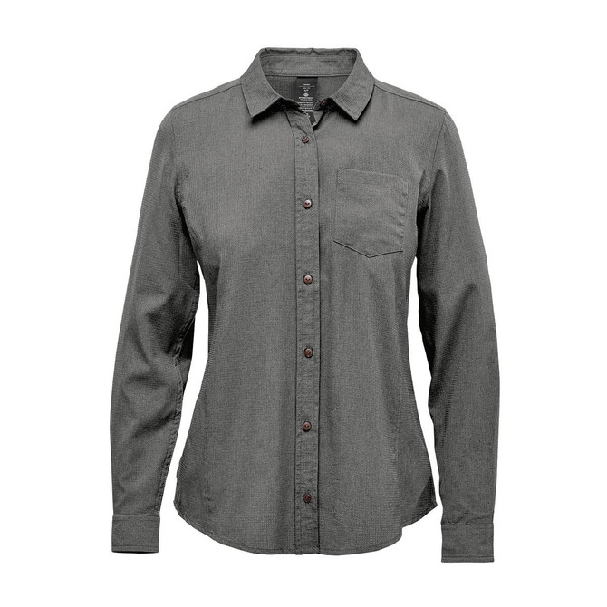 A women's button-up shirt in a green hue with long sleeves and a chest pocket. It features a logo on the label.