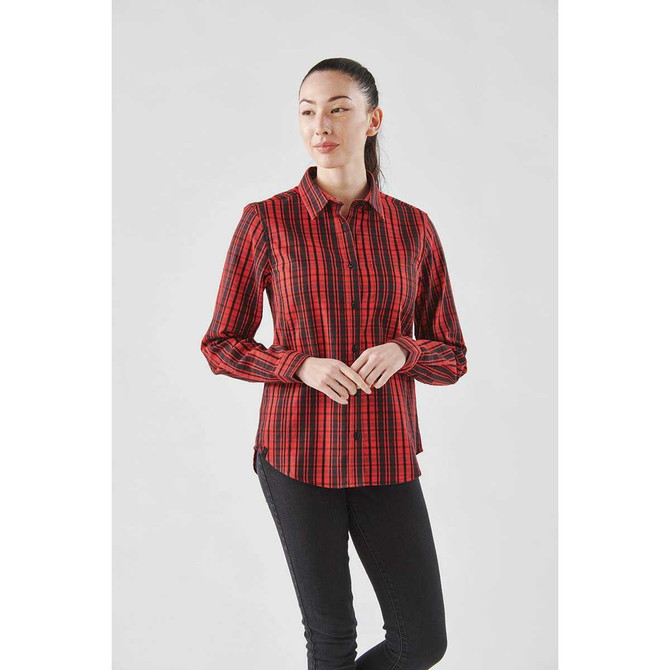 A long sleeve button-up shirt in a red and black plaid pattern, featuring a logo.