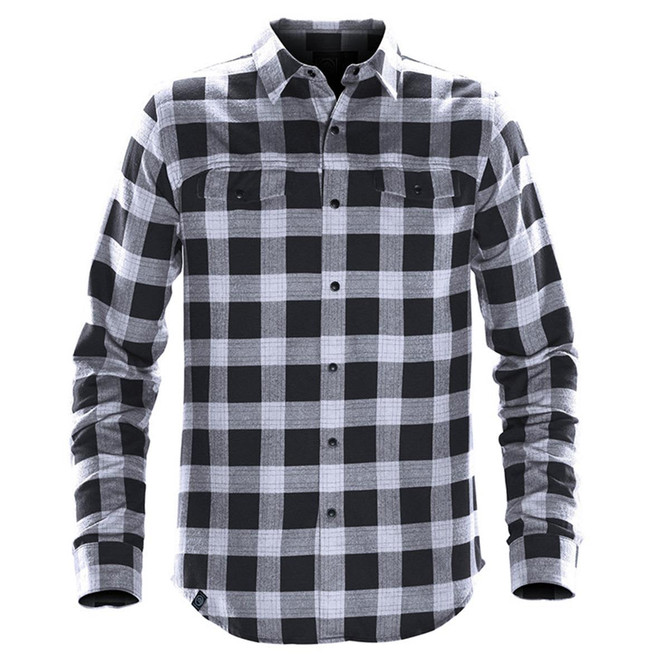 A black and white checkered button-up shirt with long sleeves and two chest pockets, featuring a logo.