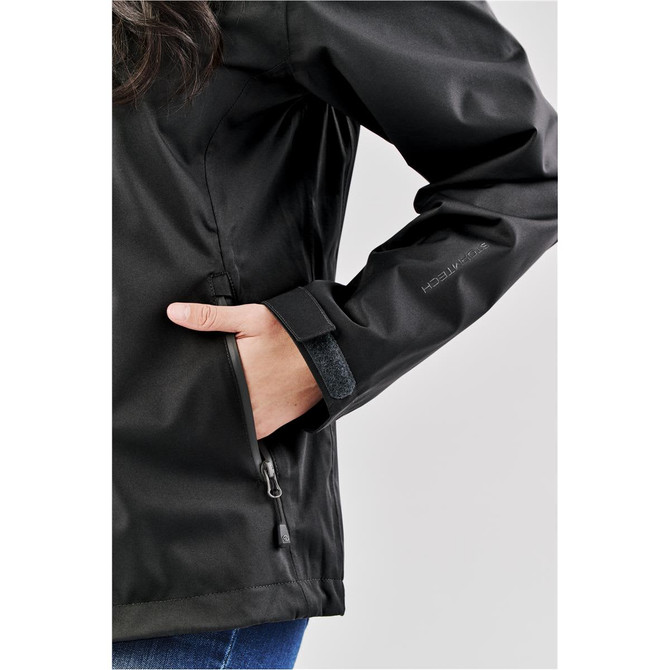 A black lightweight rain jacket with a zippered pocket, featuring a snug fit around the wrist and a branding logo.