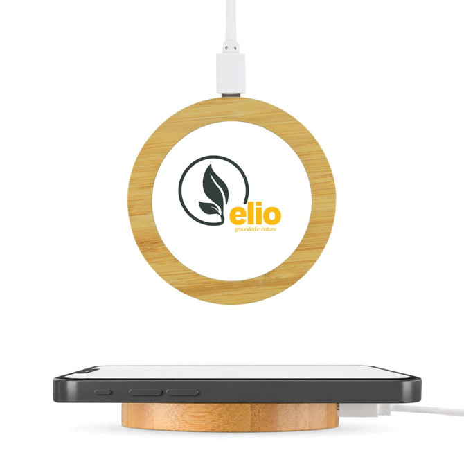 A round bamboo wireless charger in natural tones with a connected cable and a logo on the surface.
