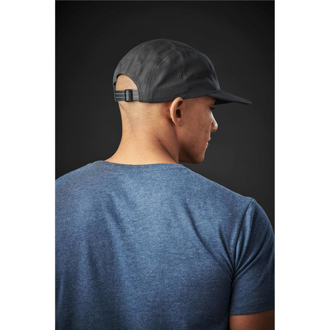 A crew neck tee in blue, worn by a person with a black cap, showcasing a simple and casual style.