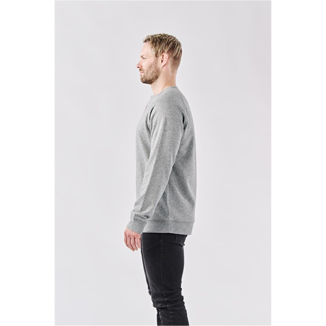 A grey long-sleeve Henley shirt is displayed on a model from the side, featuring a simple design and a logo.