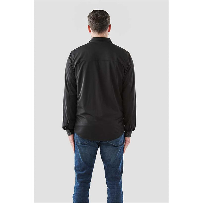 A long sleeve black button-up shirt with a standard collar, viewed from the back, paired with blue jeans.