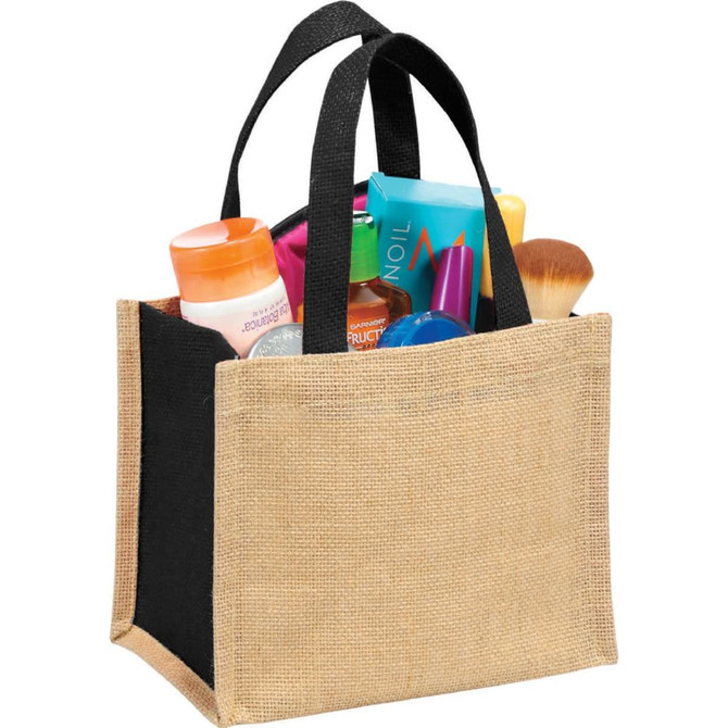 A jute gift tote bag in natural and black, filled with various cosmetic products and accessories.