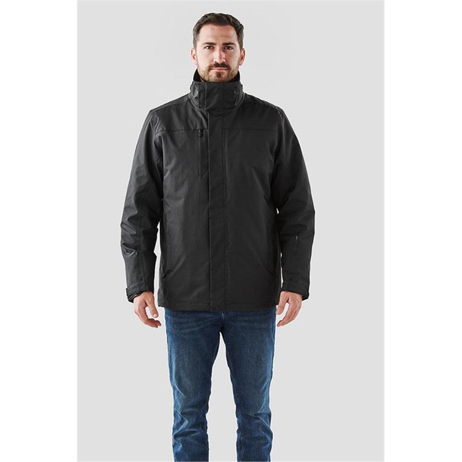 A men's black Magellan System Jacket with a high collar, featuring a front zip and pockets; includes branding.