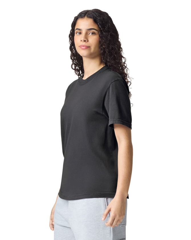 A black heavyweight adult t-shirt with short sleeves, displayed on a model. It features a logo on the shirt.