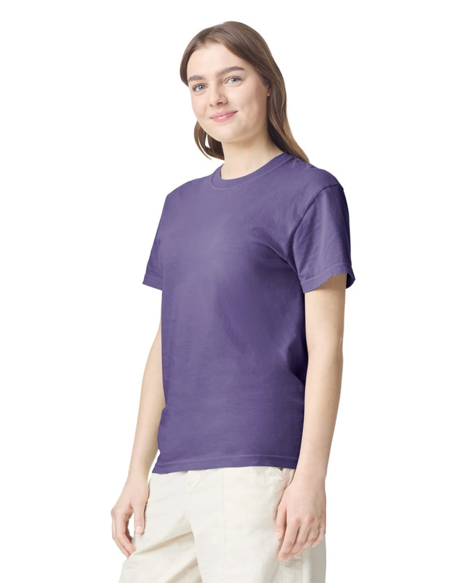 A purple adult heavyweight T-shirt displayed on a model, featuring a crew neck and short sleeves.