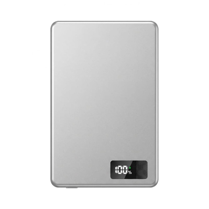 A silver power bank with a digital display showing battery percentage. It has a sleek, ultra-thin design.