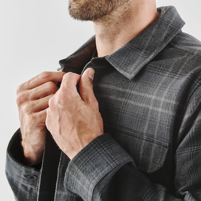 A grey and black men's shacket with a plaid pattern, featuring a buttoned collar and a logo.