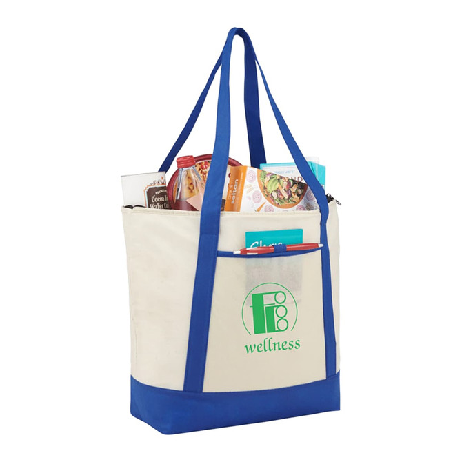 A non-woven boat tote cooler in cream and blue, filled with food and drinks, featuring a logo on the front.