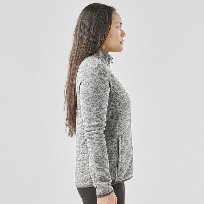 A side view of a women's grey full zip fleece jacket featuring a high collar and a branded logo.