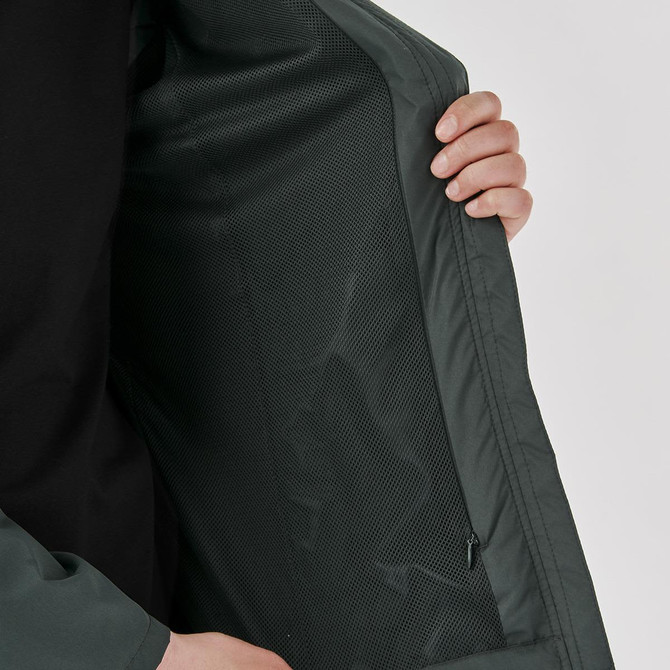 A women's full zip rain jacket in dark grey, featuring a mesh interior and a zippered pocket.