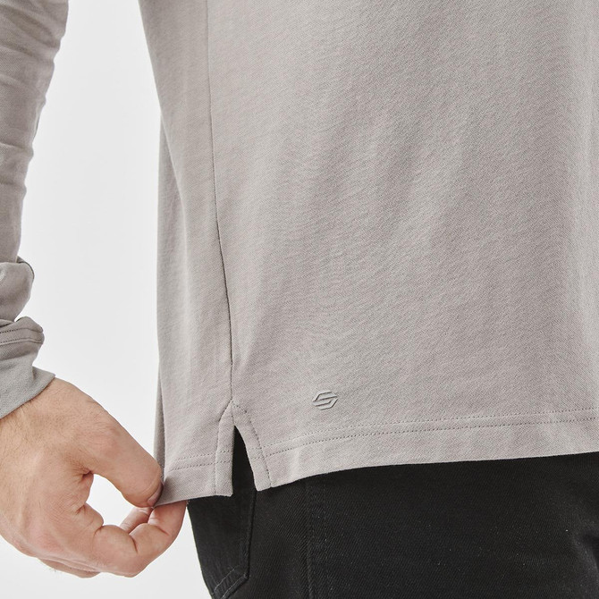 A grey long-sleeve polo shirt with a side slit, featuring a small logo near the hem.