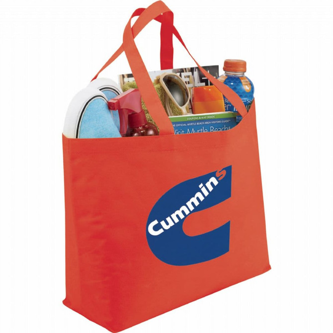 An orange non-woven tote bag with handles, containing various items and featuring a logo.
