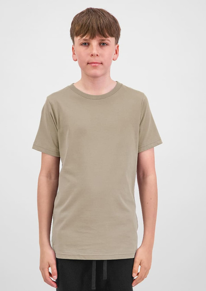 A short sleeve tee in a muted beige colour, displayed on a model with a neutral background. Features a subtle logo.
