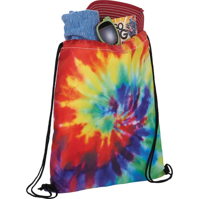 A tie-dye drawstring sportspack in vibrant rainbow colours, filled with clothing and accessories. Features a logo.