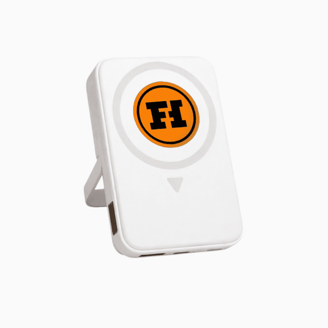 A white wireless charging powerbank with a circular design and a brand logo on the front.