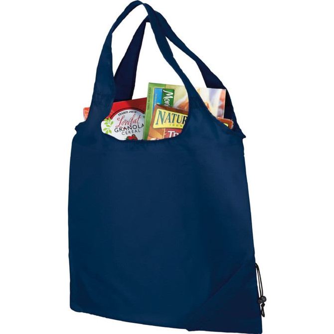 A navy blue foldaway tote bag filled with various food items, featuring a logo on the exterior.