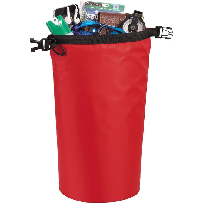 A red waterproof outdoor bag filled with assorted items, including a drink bottle, headphones, and a wallet.