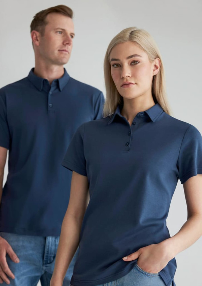 A navy blue men's short sleeve polo shirt displayed on a male and female model, featuring a subtle logo.