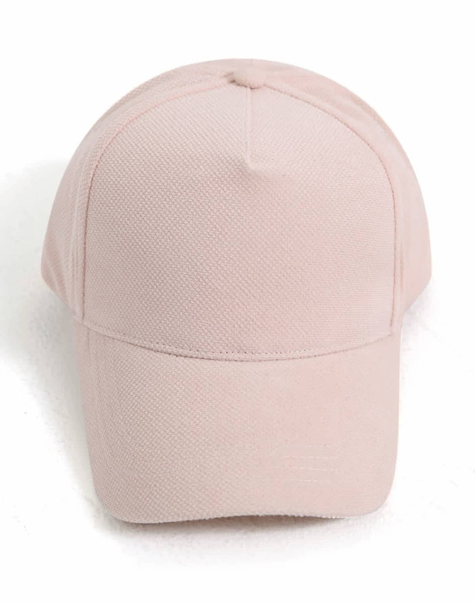 A pale pink 5-panel cap featuring a jacquard texture and a branded logo on the front.