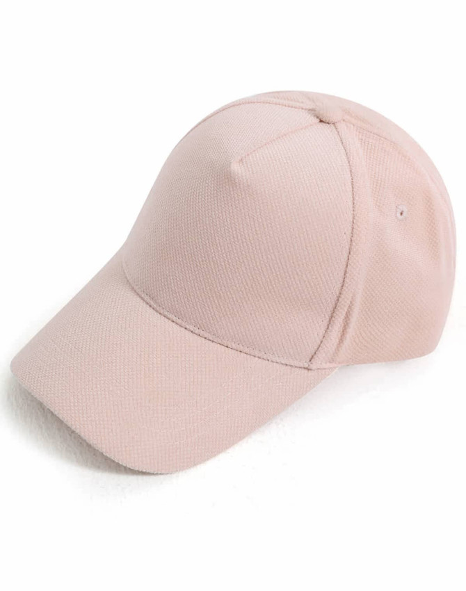 A light pink Jacquard Texture 5 Panel Cap with a curved brim and a branding logo.