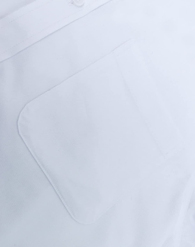 A white long-sleeve shirt featuring a pocket, made from a cotton blend with a smooth finish.