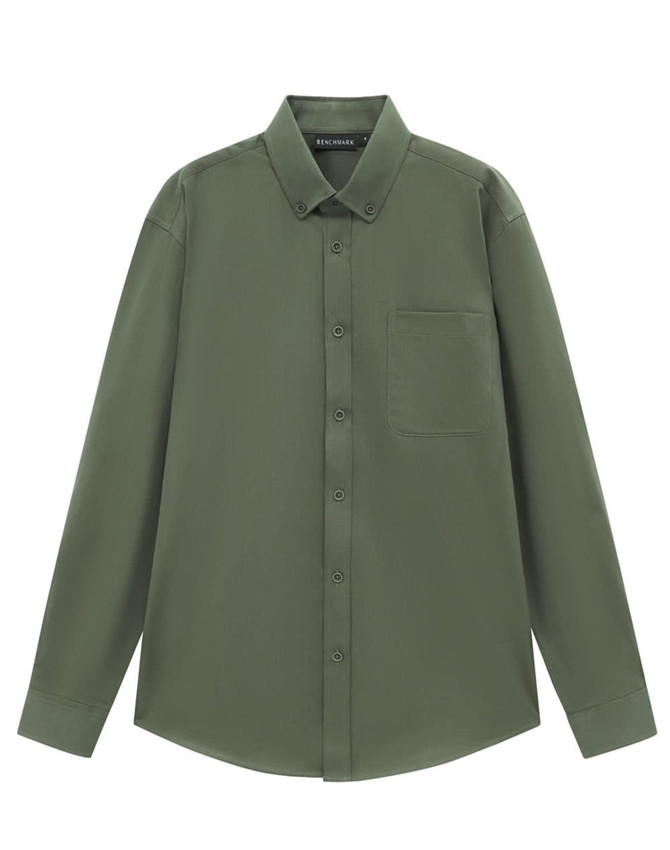 A long-sleeve cotton blend shirt in olive green with a button-up front and chest pocket. It features a brand logo.