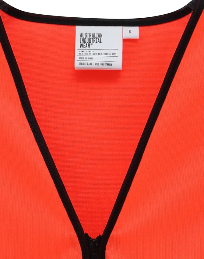 A bright orange safety vest featuring a zippered front and contrasting black trim, with a tag visible inside.