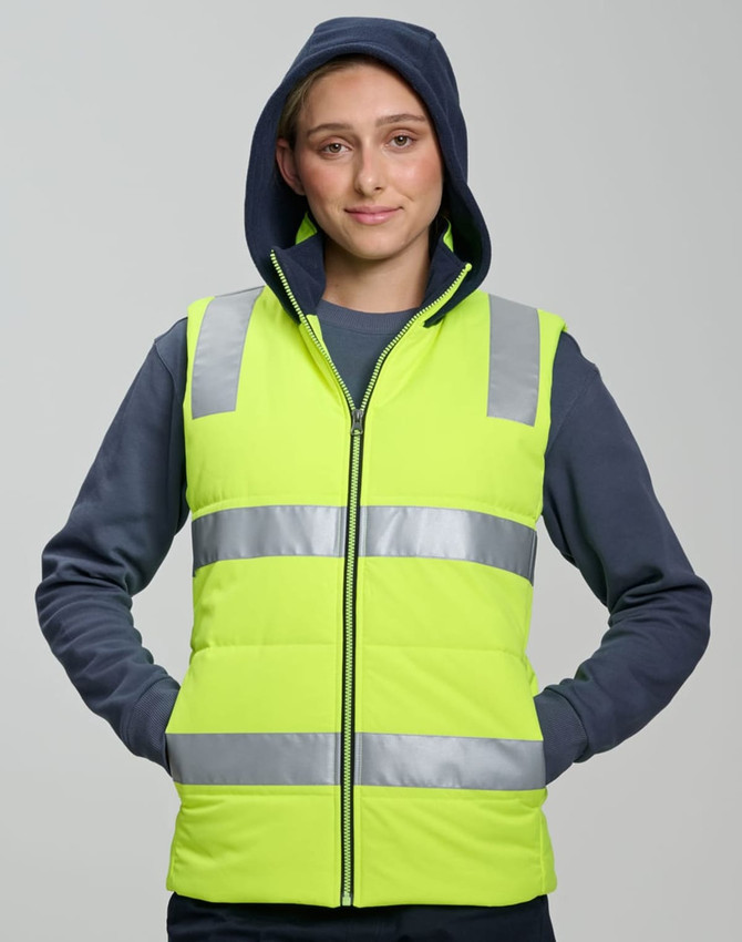 A unisex hi-vis hooded puffer vest in bright yellow with reflective stripes, worn by a model.