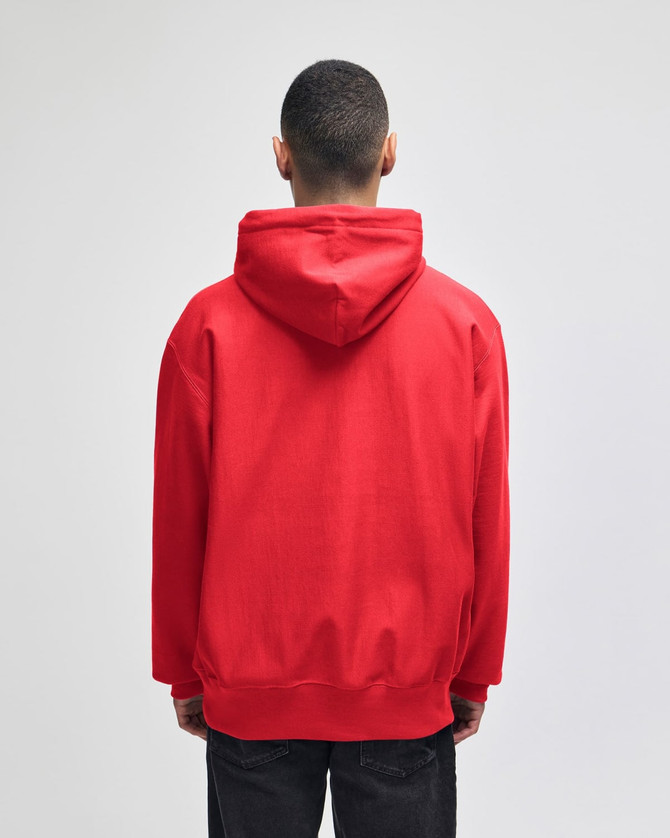 A red pullover hooded sweatshirt featuring a logo, viewed from the back.