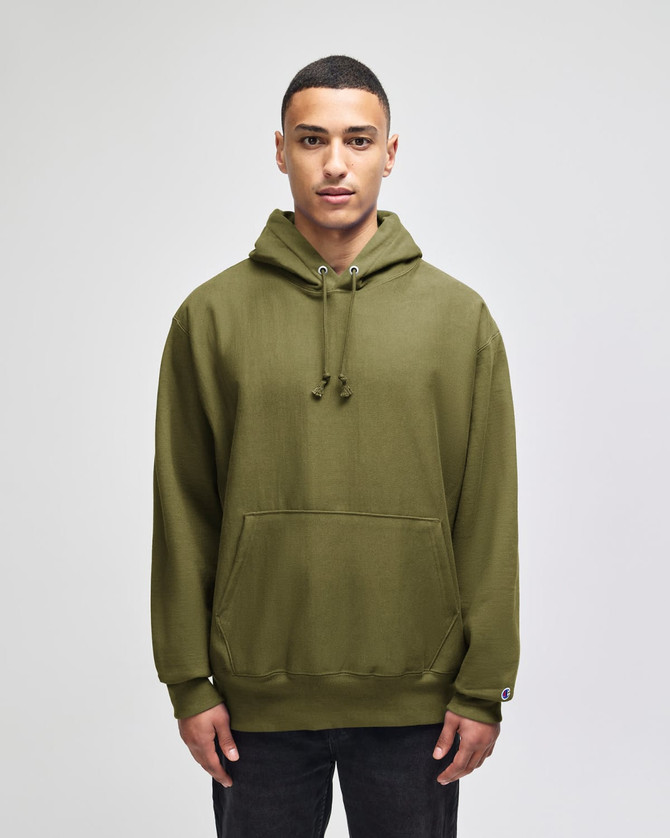 An olive green pullover hooded sweatshirt with a front pocket and a logo on the sleeve.