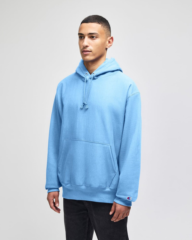 A light blue hoodie with a front pocket and a drawstring hood, featuring a logo.