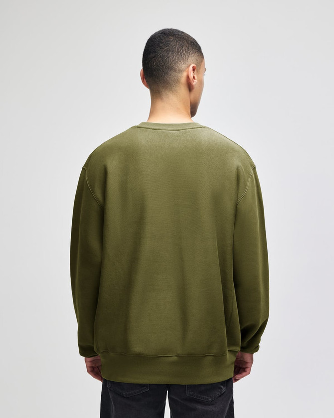 A green crew sweatshirt viewed from the back, featuring a relaxed fit and long sleeves.