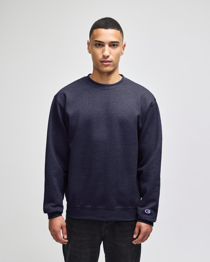 A navy blue crewneck sweatshirt with a logo on the sleeve, featuring a relaxed fit and long sleeves.
