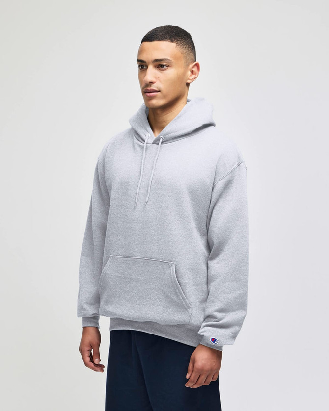 A grey pullover hooded sweatshirt with a front pocket and a logo on the sleeve.