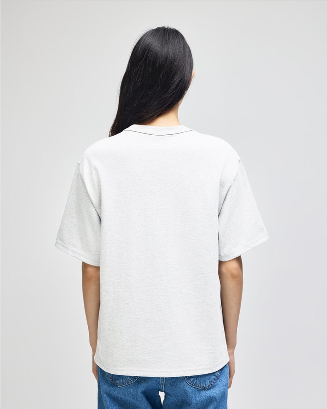 A plain white adult t-shirt, shown from the back, features a relaxed fit and a simple design.