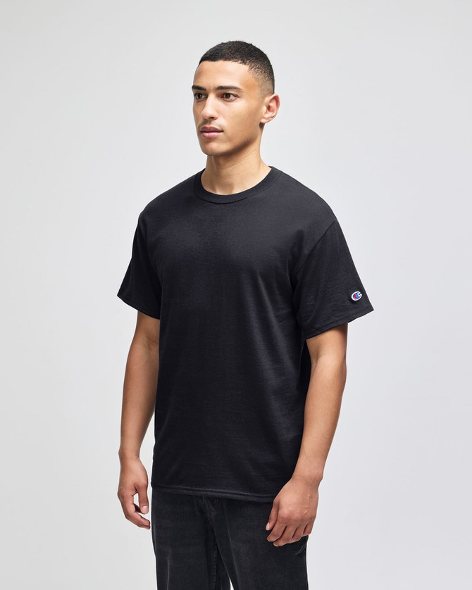 A black Champion adult short-sleeve t-shirt featuring a small logo on the sleeve.