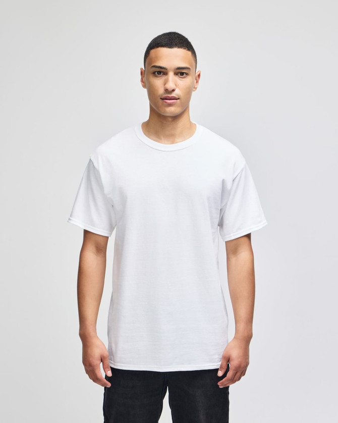 A white short-sleeve t-shirt worn by a model, featuring a simple design and a logo.