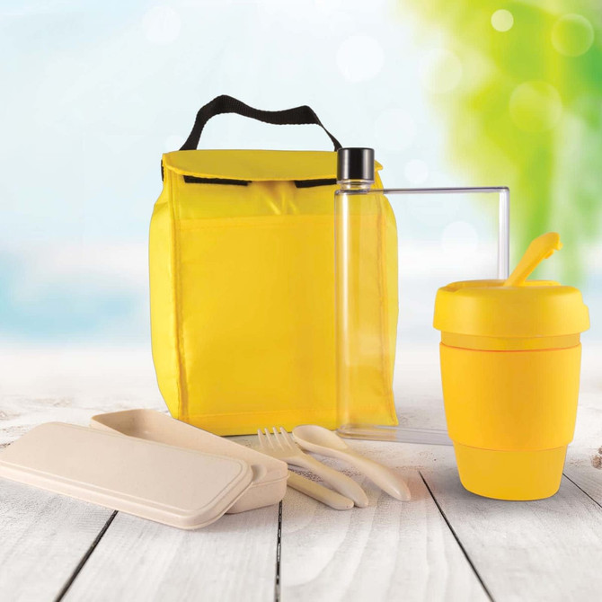 A yellow picnic bag containing a drink bottle, a reusable cup, cutlery, and food containers.