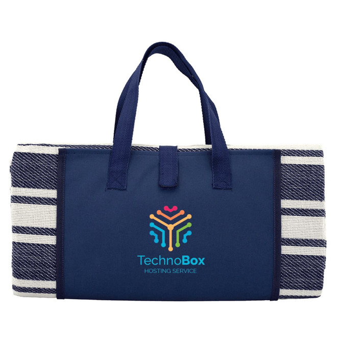 A navy blue picnic rug with a striped pattern and carrying handles, featuring a logo on the front.