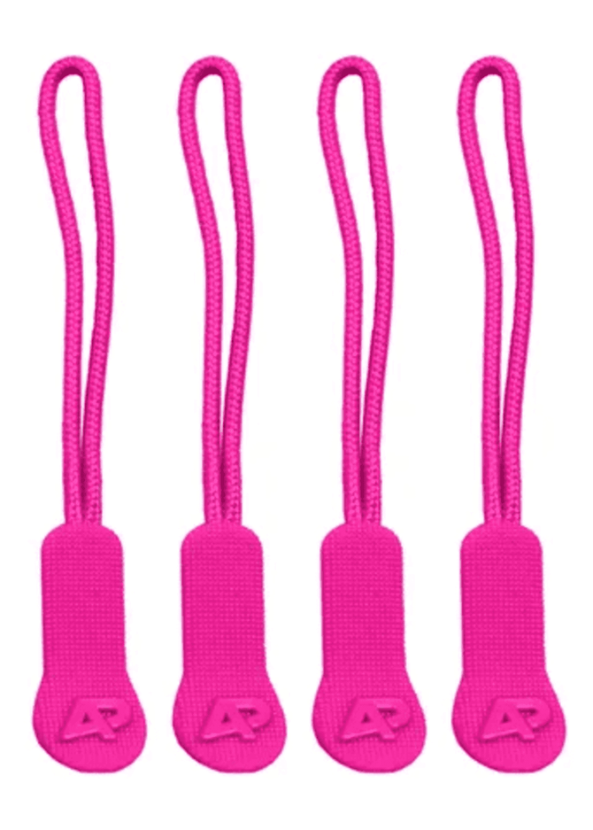 Four pink zip puller accessories made of fabric, each with a textured grip and a small logo on the tab.