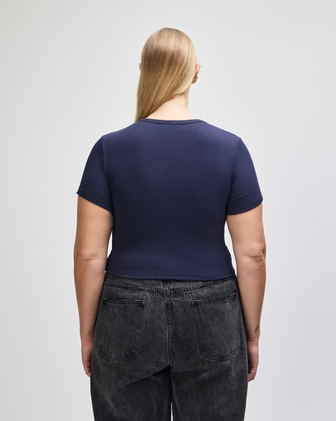 A navy blue fitted crop T-shirt with short sleeves, showcasing a simple design from the back.