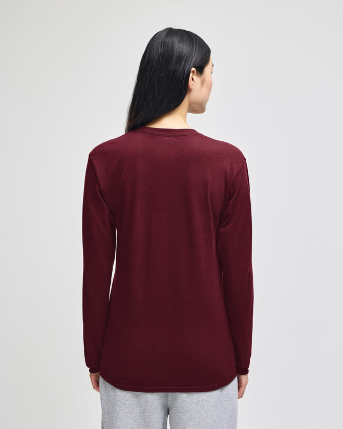 A long-sleeve t-shirt in burgundy, featuring a simple design and a logo on the back.